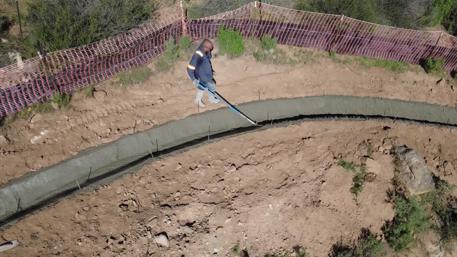 V-ditch pour along a fence