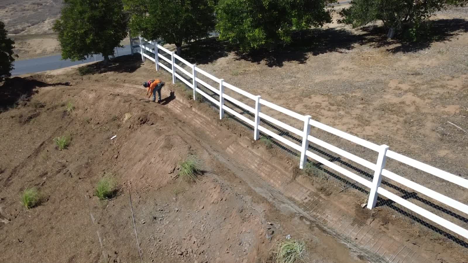 Concrete being placed in a V-ditch